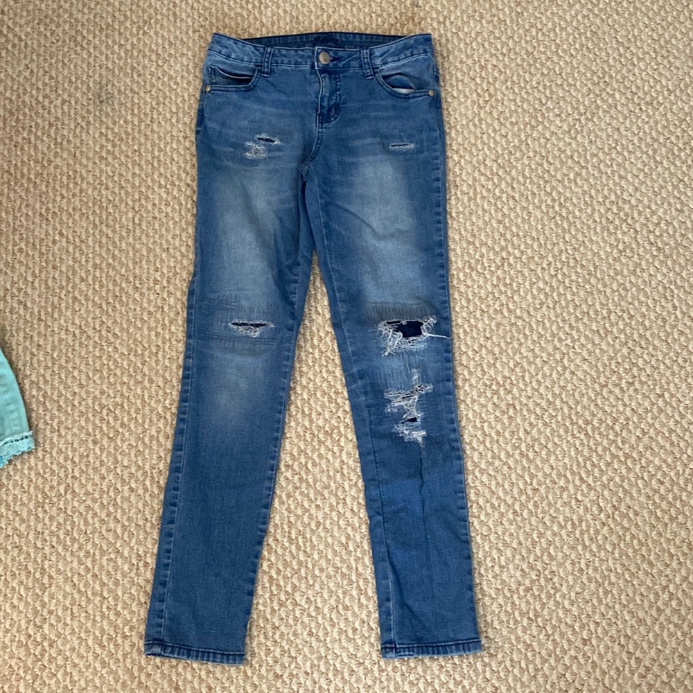 Justice kids size 14 jeans. Fake Rips on the front.